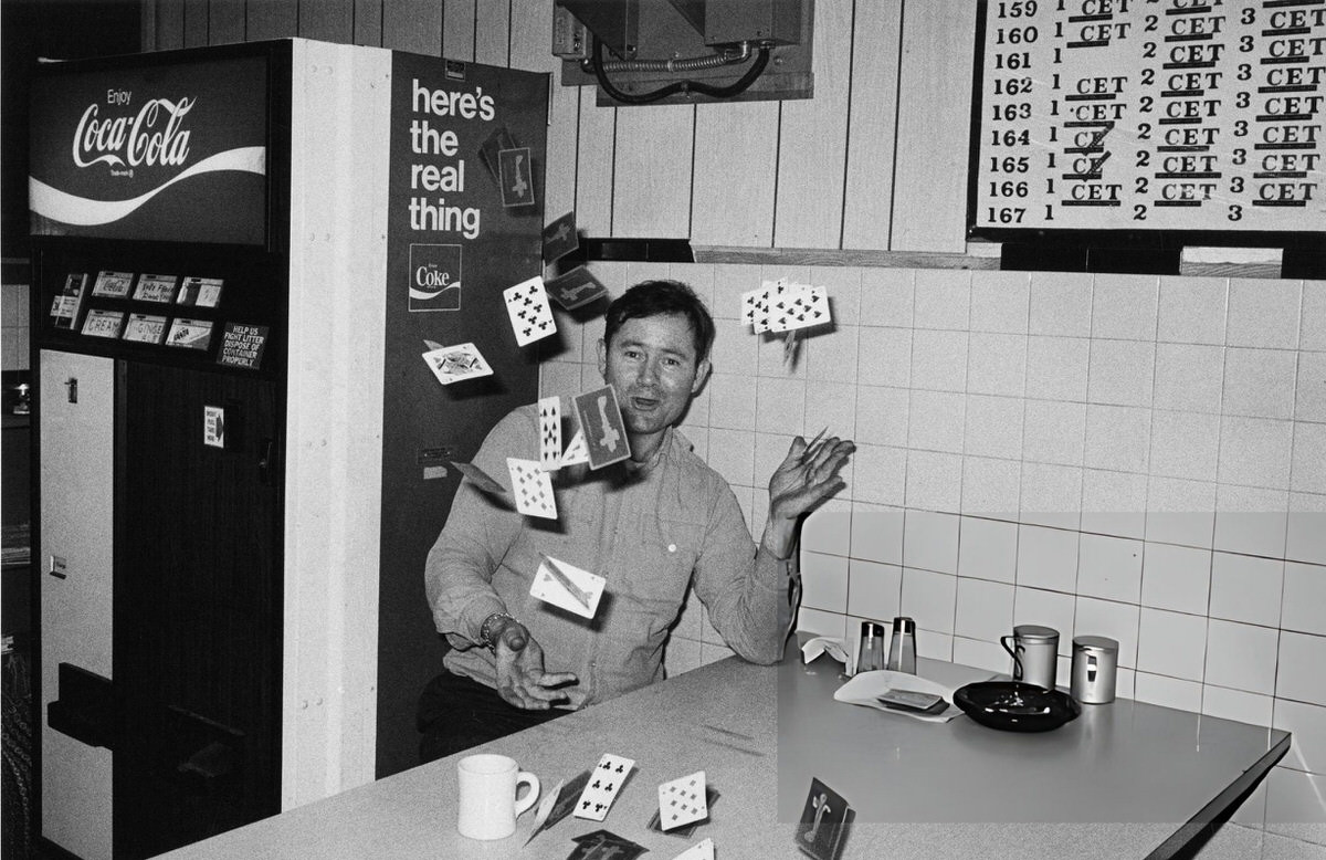 Fire Lieutenant Throwing Cards In The Air At The &Amp;Quot;Harlem Hilton&Amp;Quot; Firehouse, 1976.