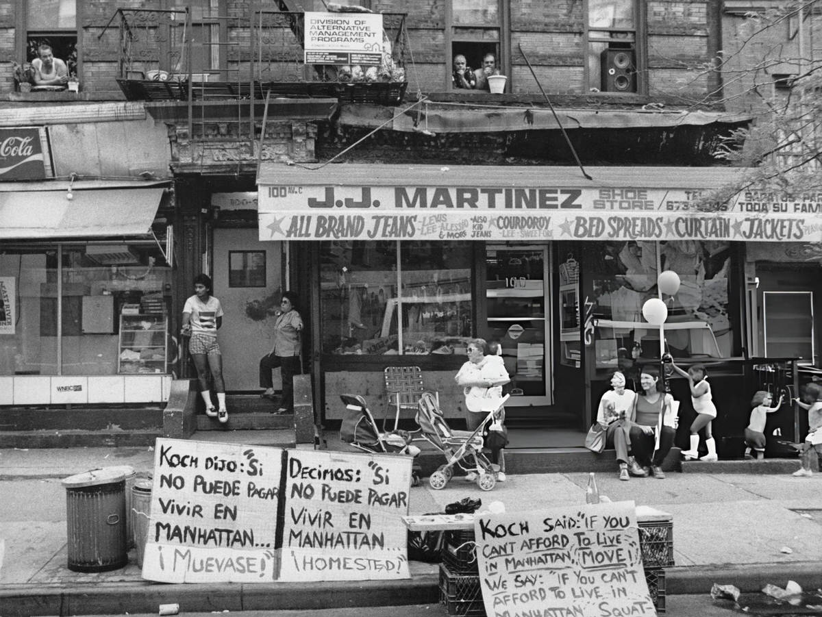 People Gathered Outside A Clothes Store In Spanish Harlem, 1980.