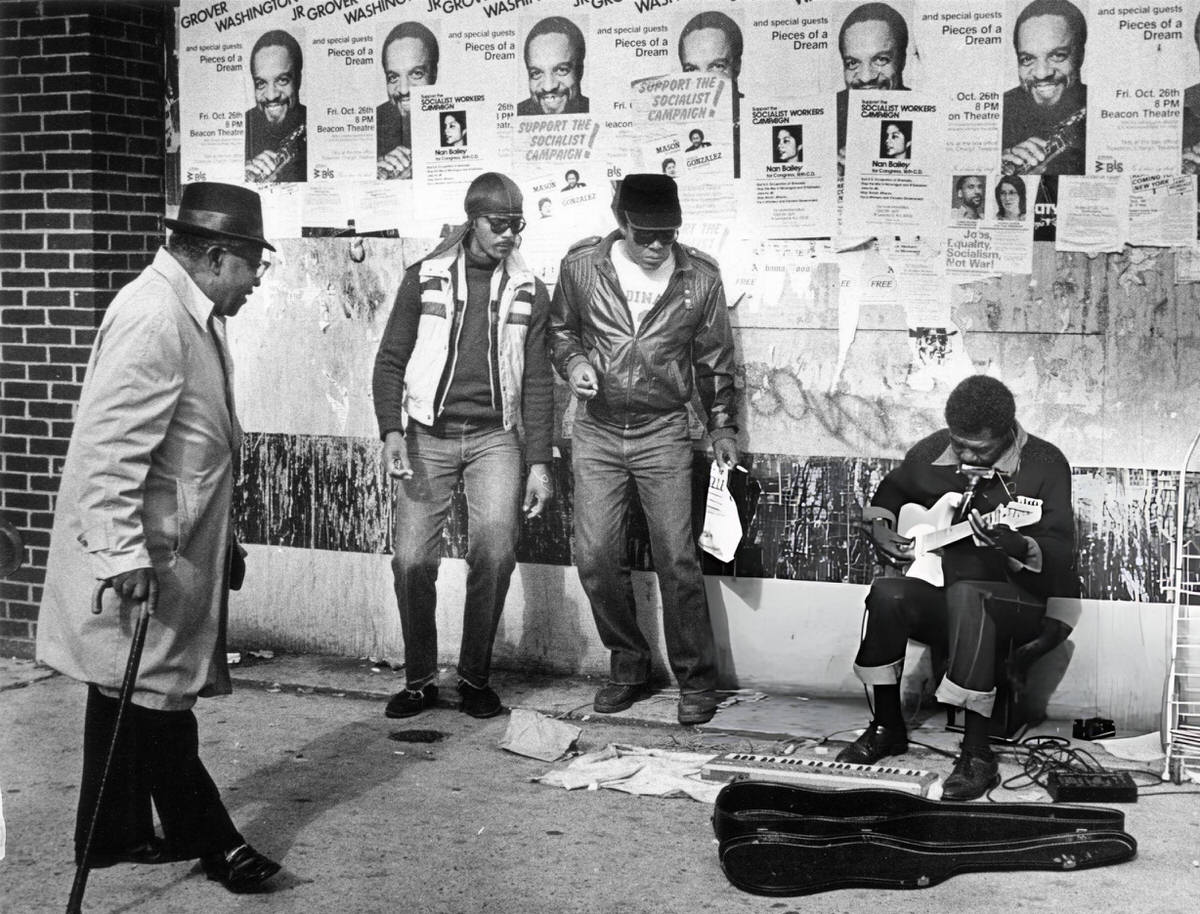 Musician Playing Guitar And Harmonica On 125Th Street, Harlem, 1986.