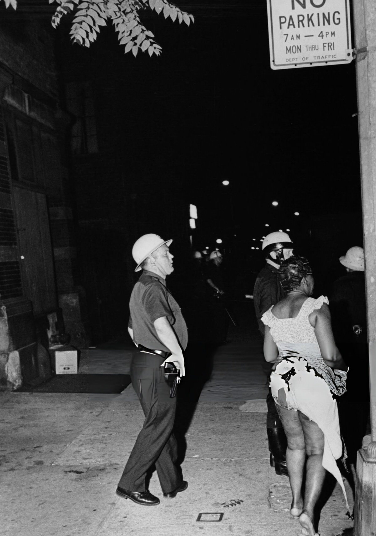 Police Officers Responding To A Call Involving A Woman Injured By A Molotov Cocktail During The Harlem Riots, 1964.