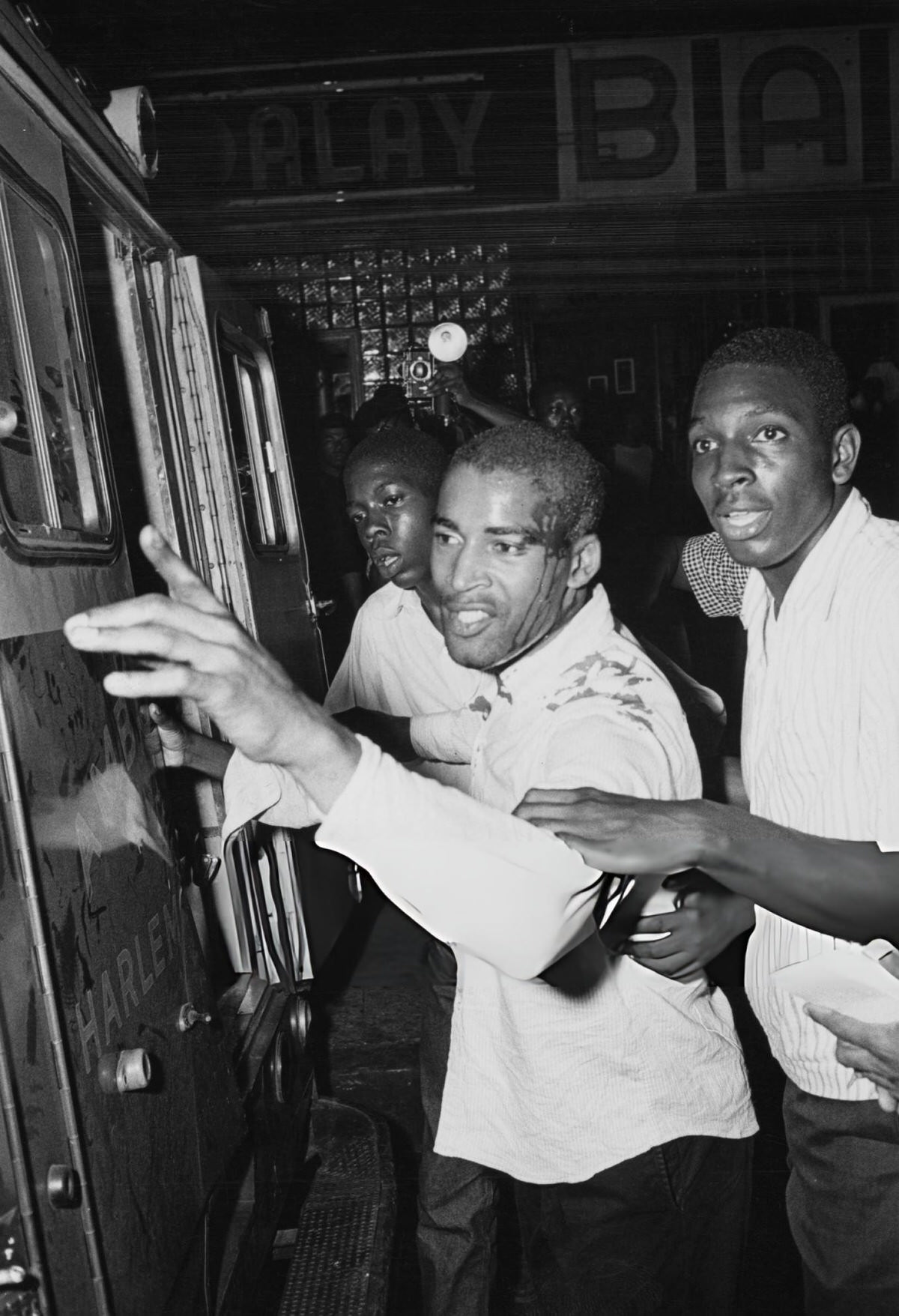 Injured Men Entering An Ambulance During The Harlem Riots, 1964.
