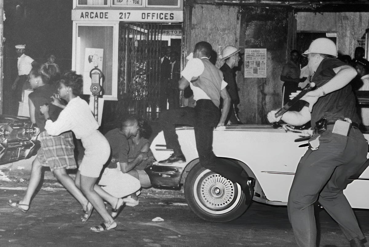 Police Pursuing People During The Harlem Riots, 1964.