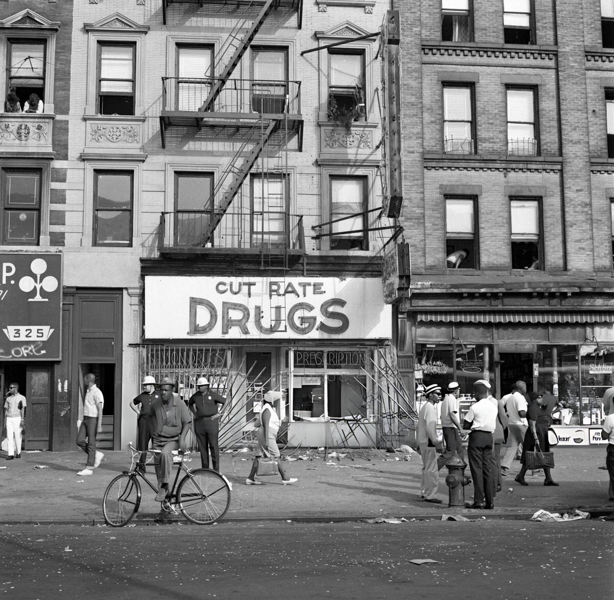 Smashed Windows Of A Drug Store On Lenox Avenue Near 128Th Street After The Harlem Riots, 1964.