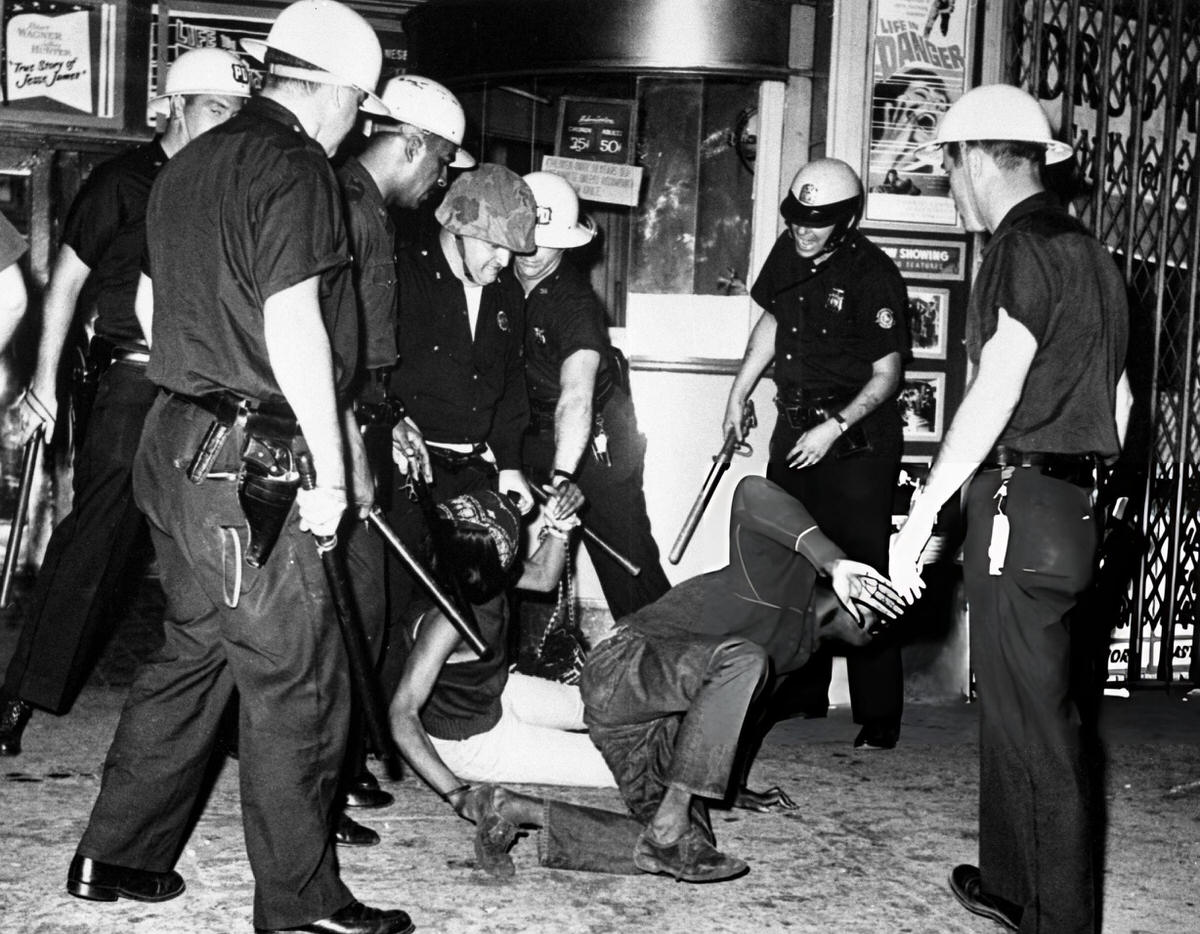 Riot Police Closing In On A Man And Woman During The Harlem Riots, 1964.