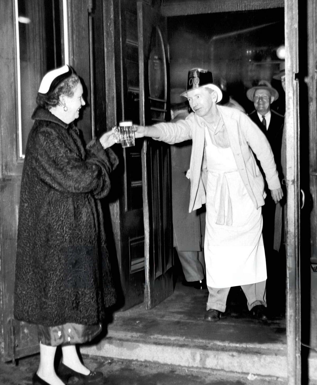 Owner Dorothy O'Connell Kirwan Receiving A Mug Of Ale Outside Mcsorley'S Old Ale House During The 100Th Anniversary Celebration, 1954.