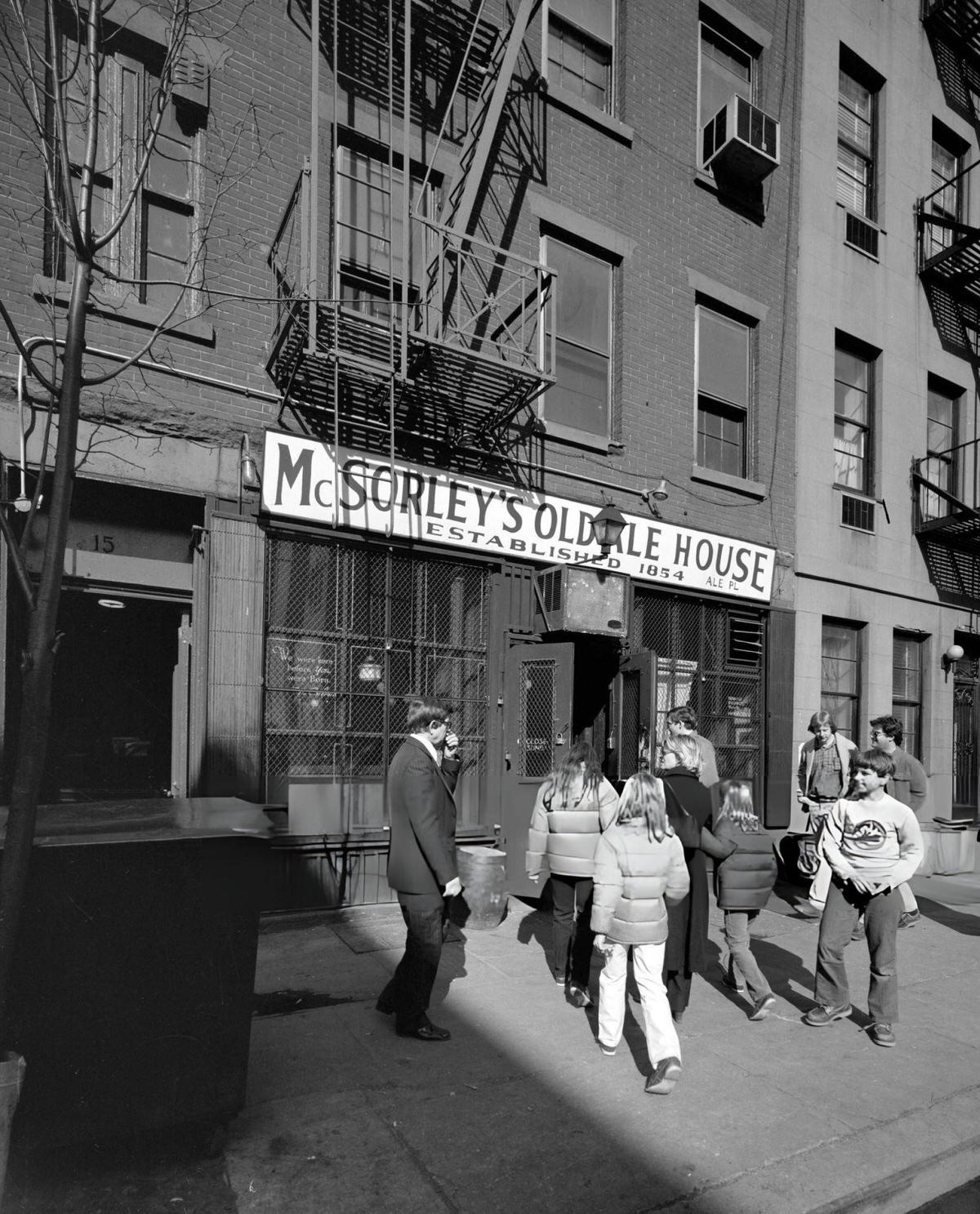 Group Entering Mcsorley'S Old Ale House At 15 East 7Th Street, New York, 1975.