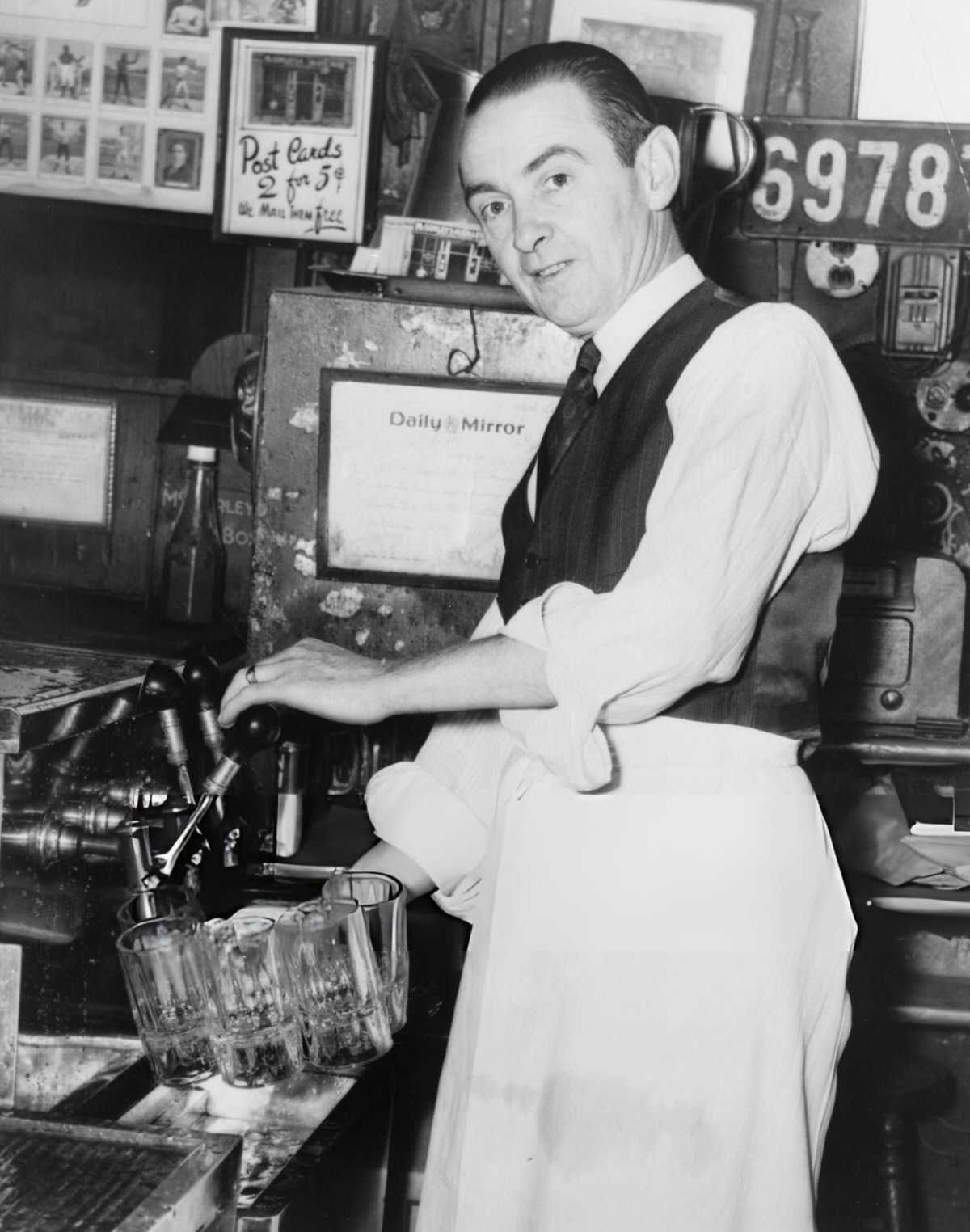 Bartender Harry Kirwan Filling Beer Mugs At Mcsorley'S Old Ale House, New York, 1954.