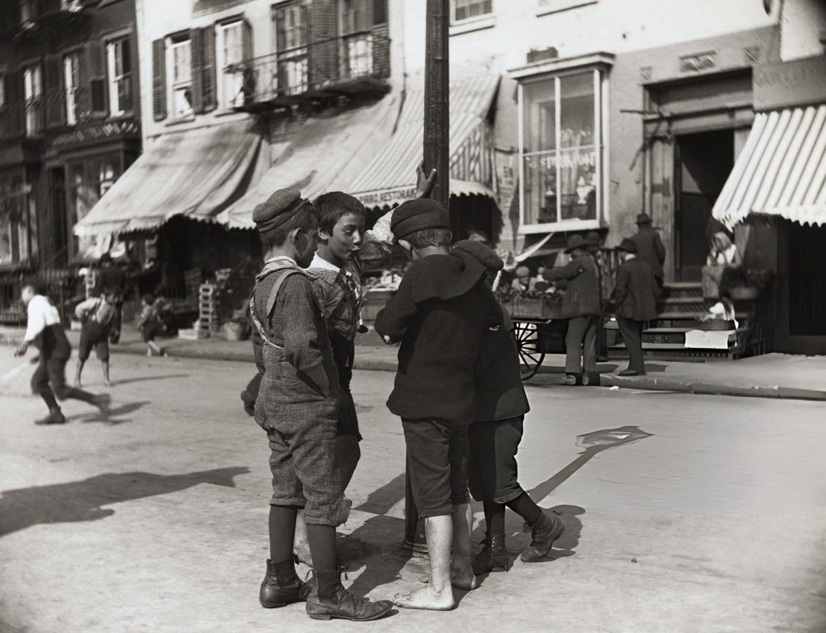Four Young Boys Standing By A Pole At Mulberry Bend.