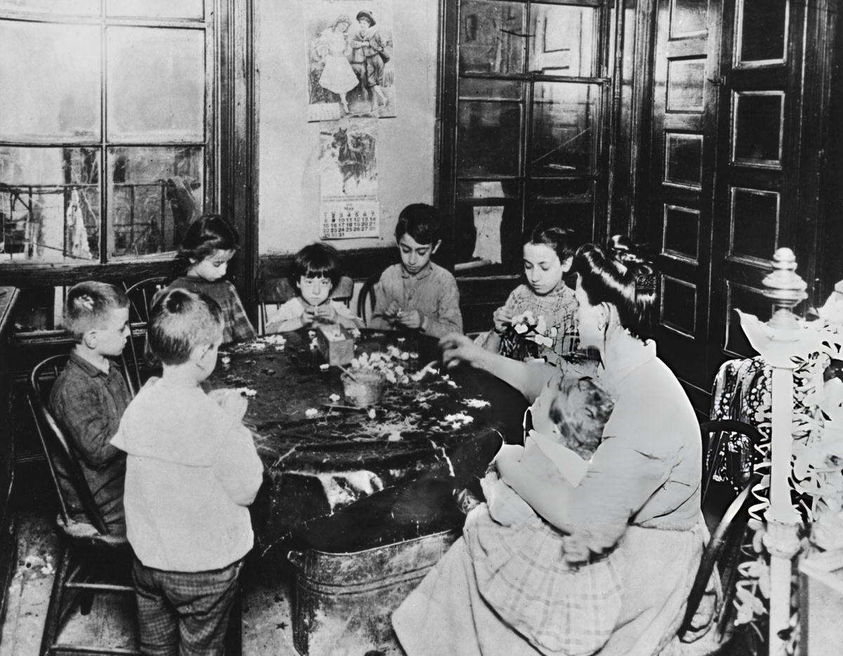 Woman And Children Making Artificial Flowers In A Tenement, New York, 1890.