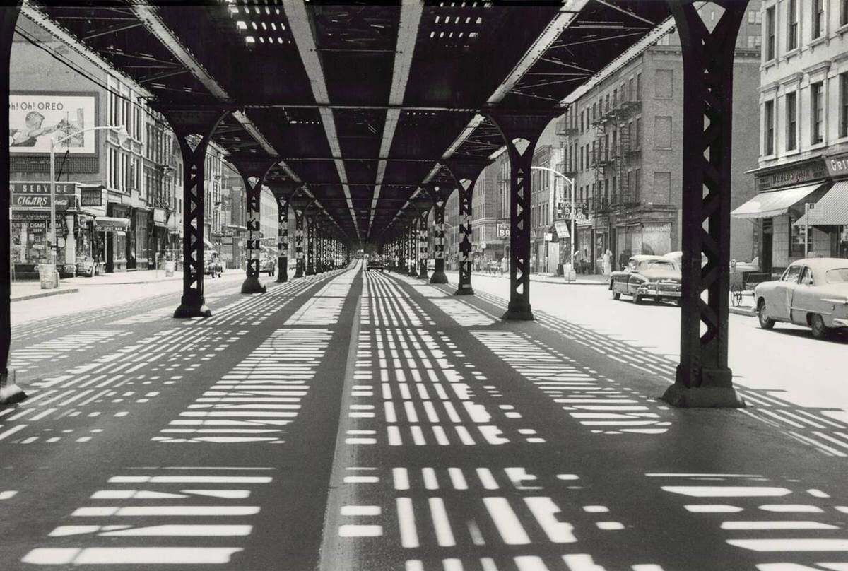 Street Scene Underneath An Elevated Railway, New York, 1953.