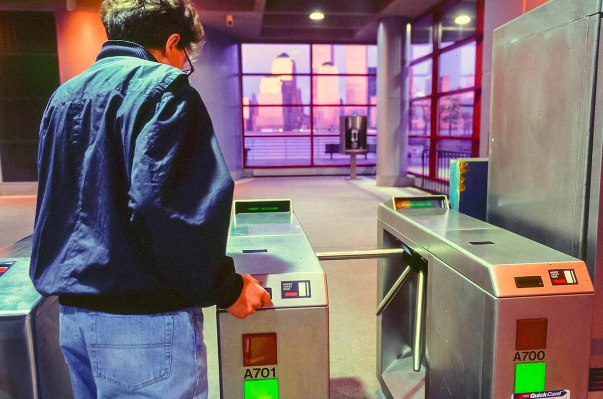 Man Entering A Turnstile At A Path Station, New York, 1991.