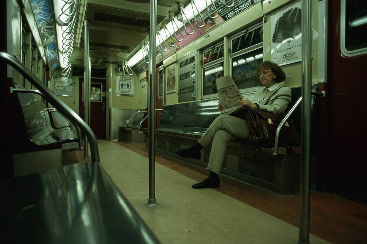Woman In An Empty Subway Car, New York, 1999.