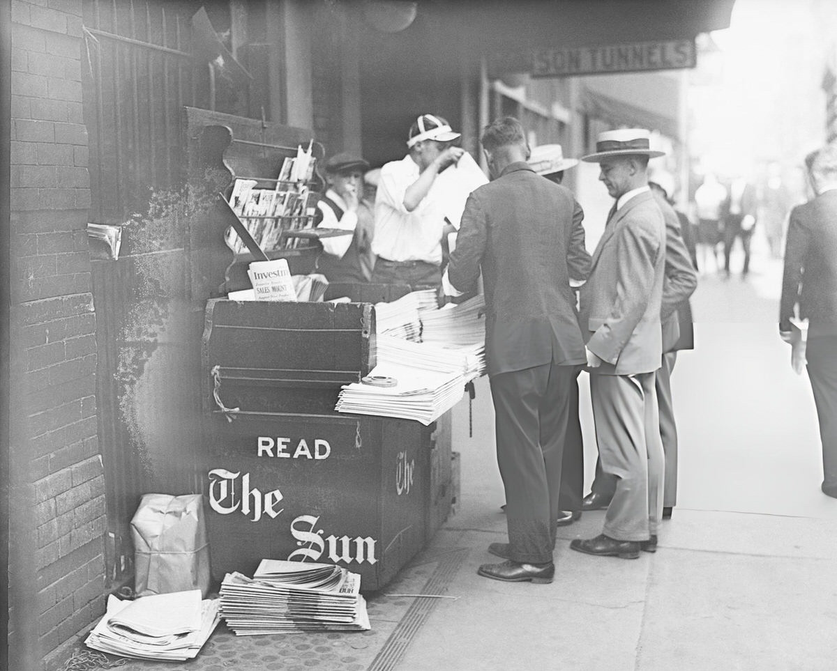 People Buying Newspapers At A Stand, New York.