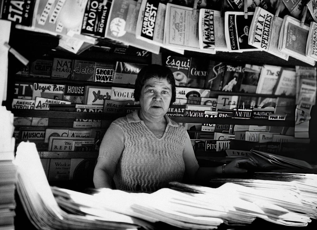 Woman Selling Newspapers And Magazines At A Sidewalk Newsstand At 42Nd Street And Madison Avenue, New York, 1930S.