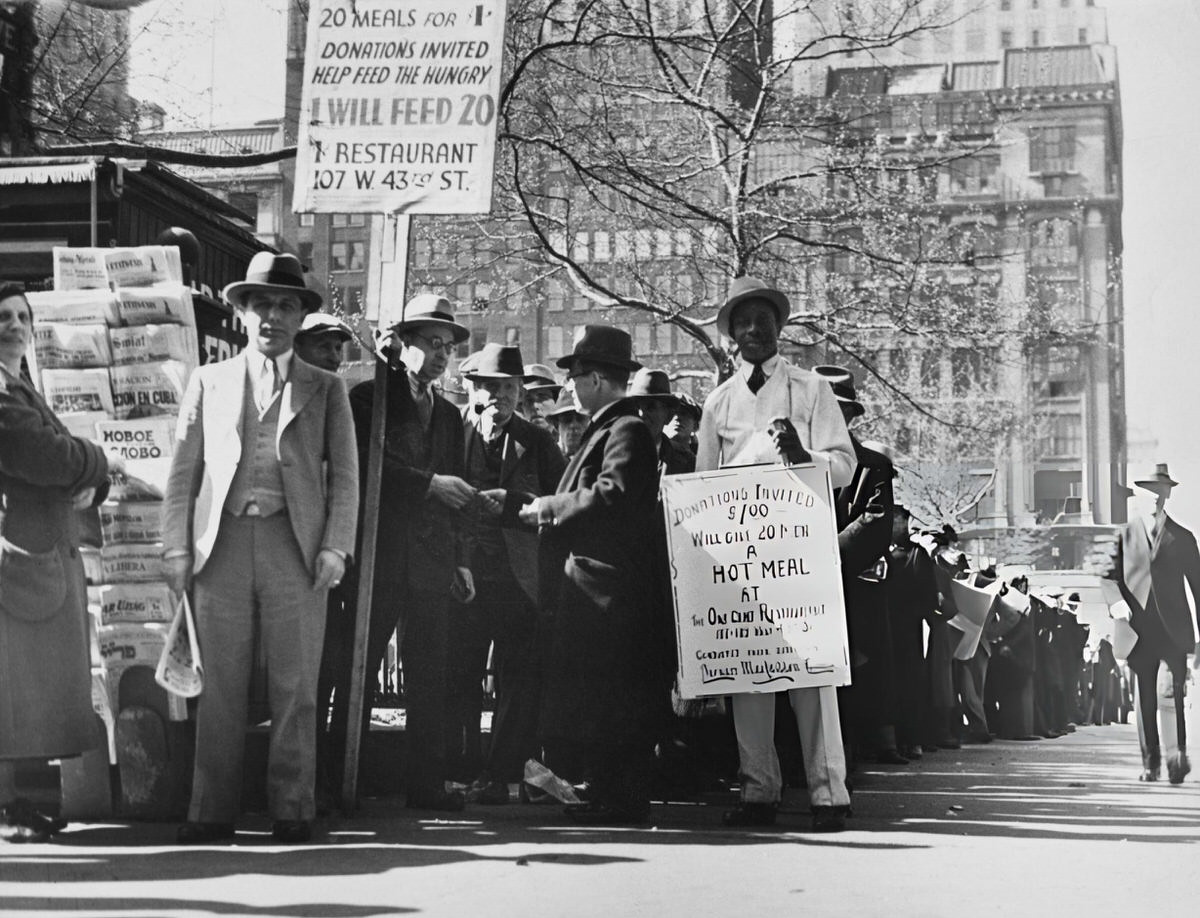 Men With Placards For The Bernarr Macfadden Foundation One-Cent Restaurant Standing Near A Newsstand, New York, 1935.