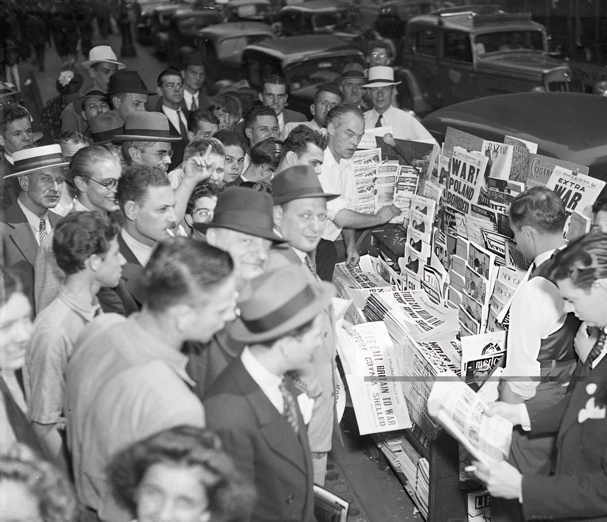 Group Of People At A Newsstand During The Outbreak Of War In Europe, New York, 1939.
