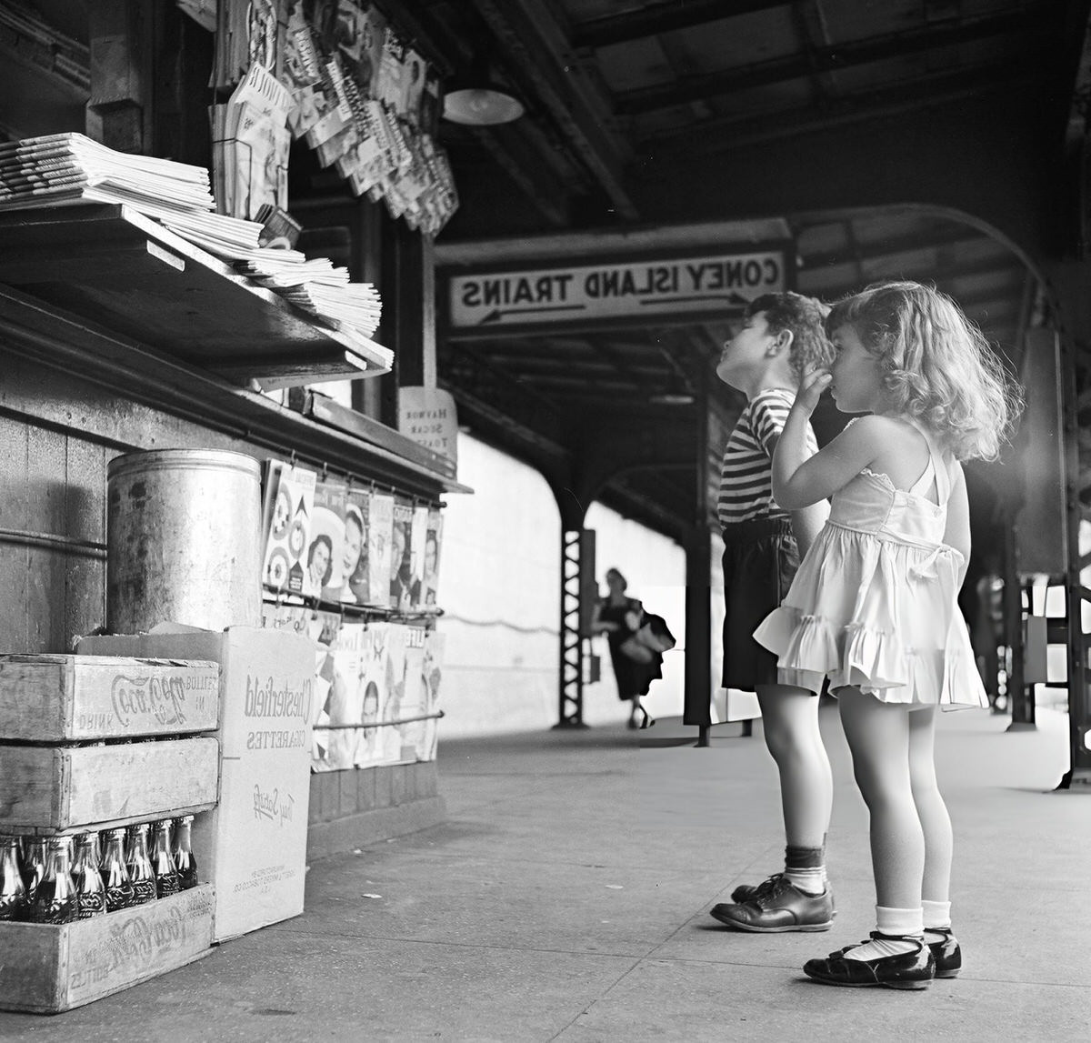 Siblings Looking At A Newsstand On A Subway Platform, New York, 1948.