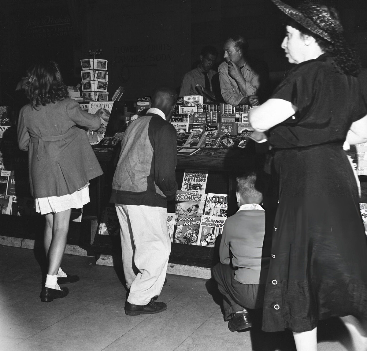 Children Looking At Magazines At A Grand Central Station Newsstand While Waiting For Camp Transportation, New York, 1948.