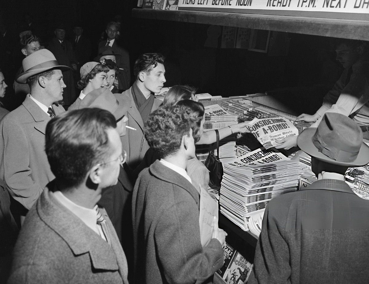 Crowds At A Grand Central Station Newsstand Reading Headlines About The Potential Use Of The Atomic Bomb, 1950.