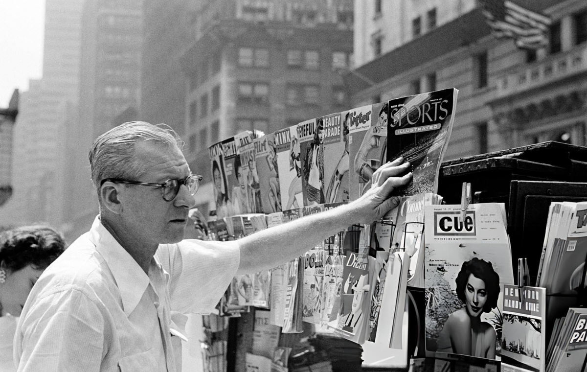Man Reaching For The Premiere Issue Of Sports Illustrated At A Manhattan Newsstand, New York, 1954.