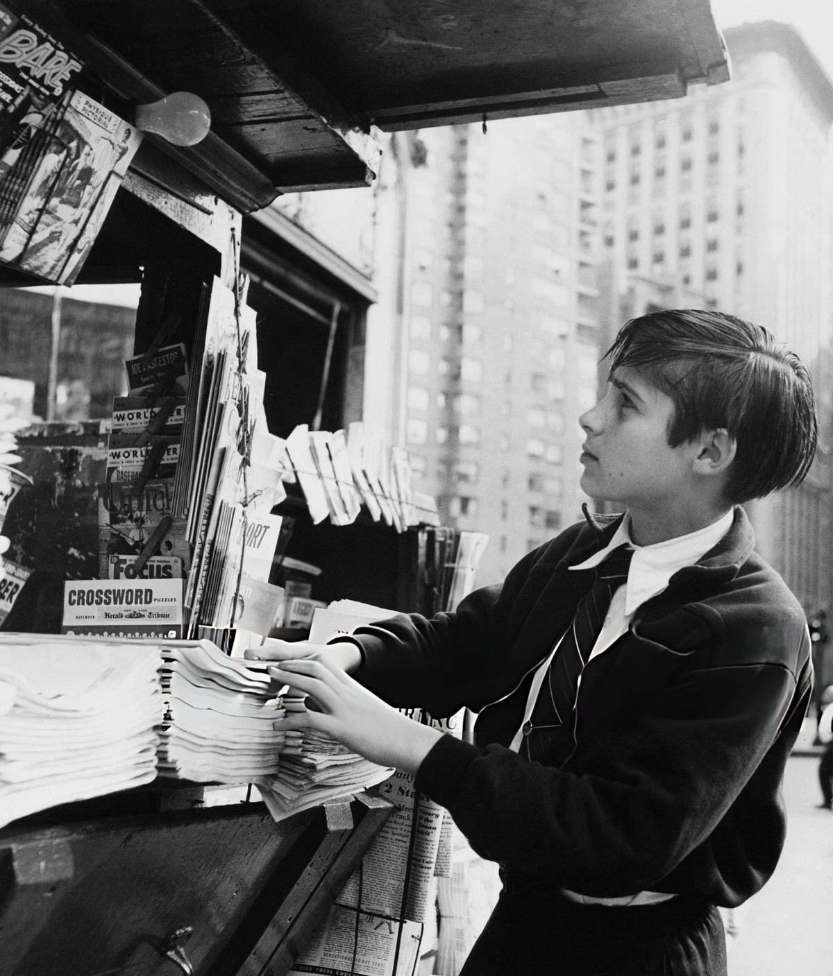 Boy At A Newspaper Stand, New York, 1955.