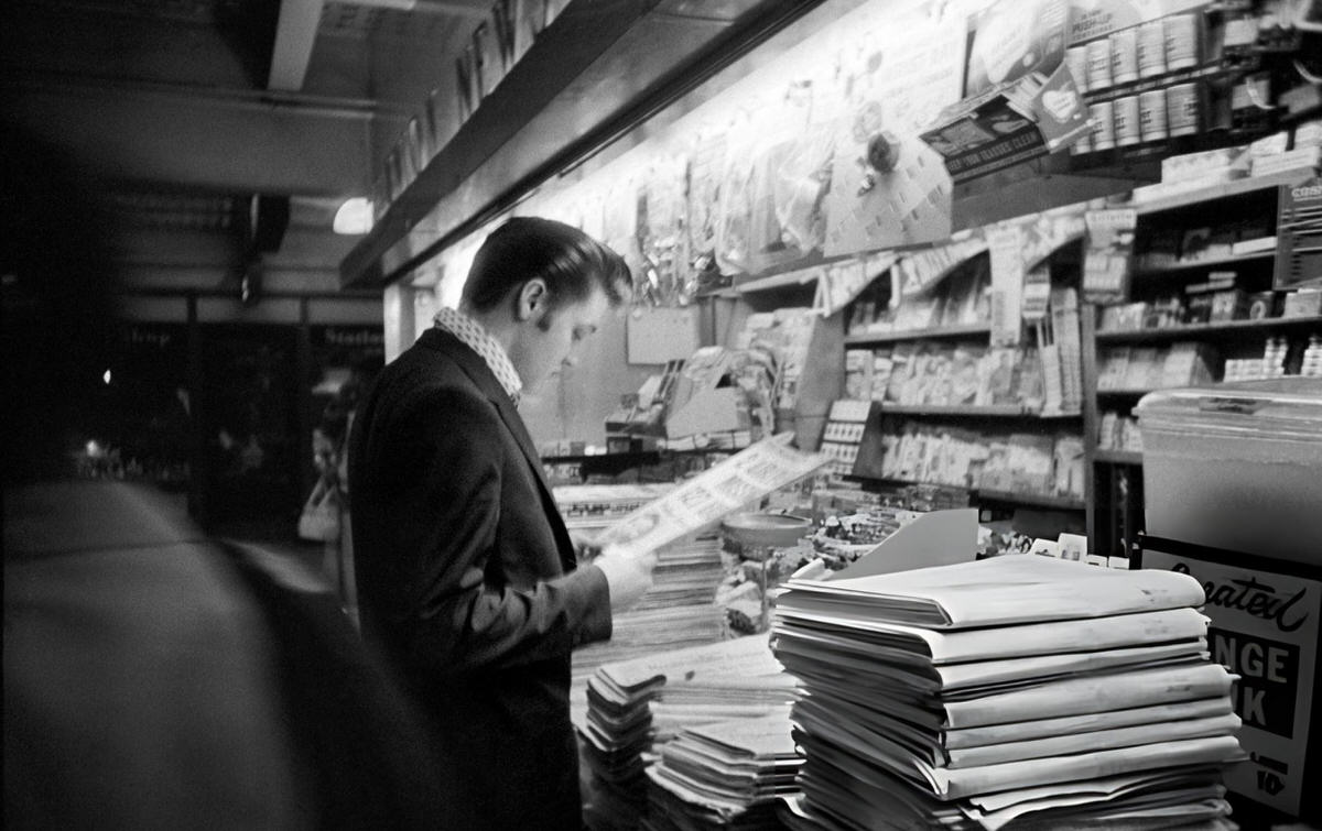 Elvis Presley Reading At A Newsstand In Penn Station, New York, 1956.