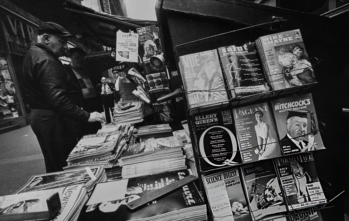 Man Viewing Magazines At A Newsstand, New York, 1962.