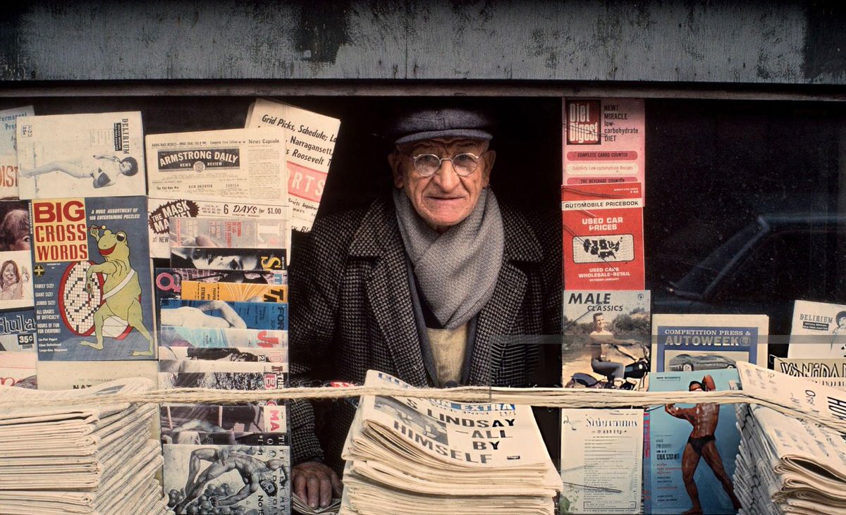 Newsstand Vendor With Newspapers And Magazines, New York, 1970.