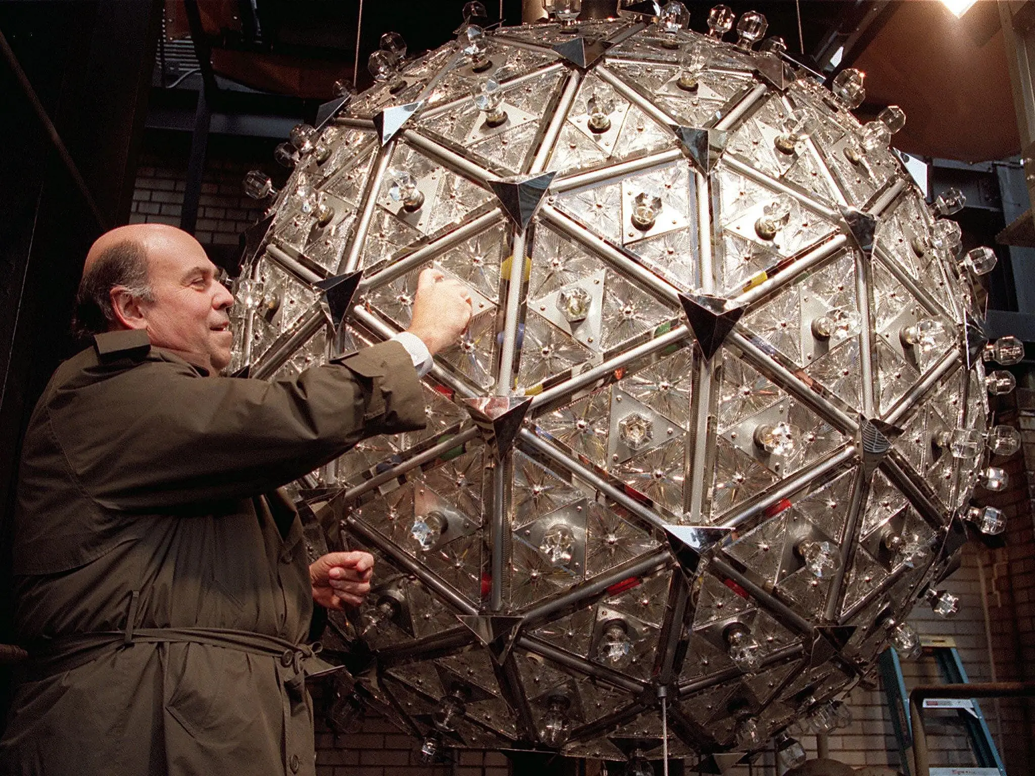 In 2000, The Ball Was Redesigned Again For The Millennium Celebration At The Crossroads Of The World. Steven Goldmacher Of Philips Lighting Company Screws In One Of The 168 Light Bulbs In The Times Square New Year'S Eve Ball In 1999.