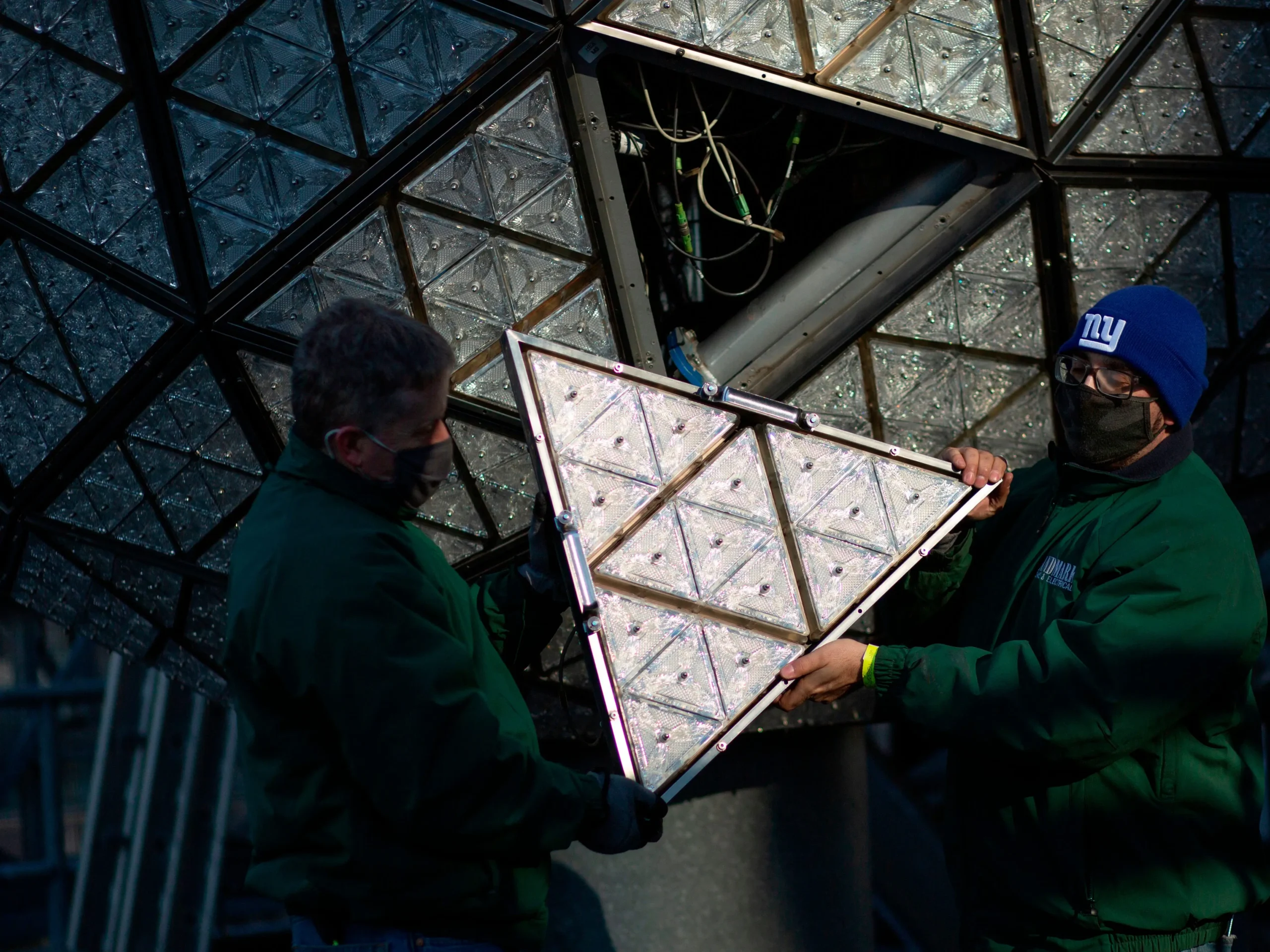 Workers Hold A New Waterford Crystal Triangle Next To The New Year'S Eve Ball For The 2021 New Year'S Eve Celebration.