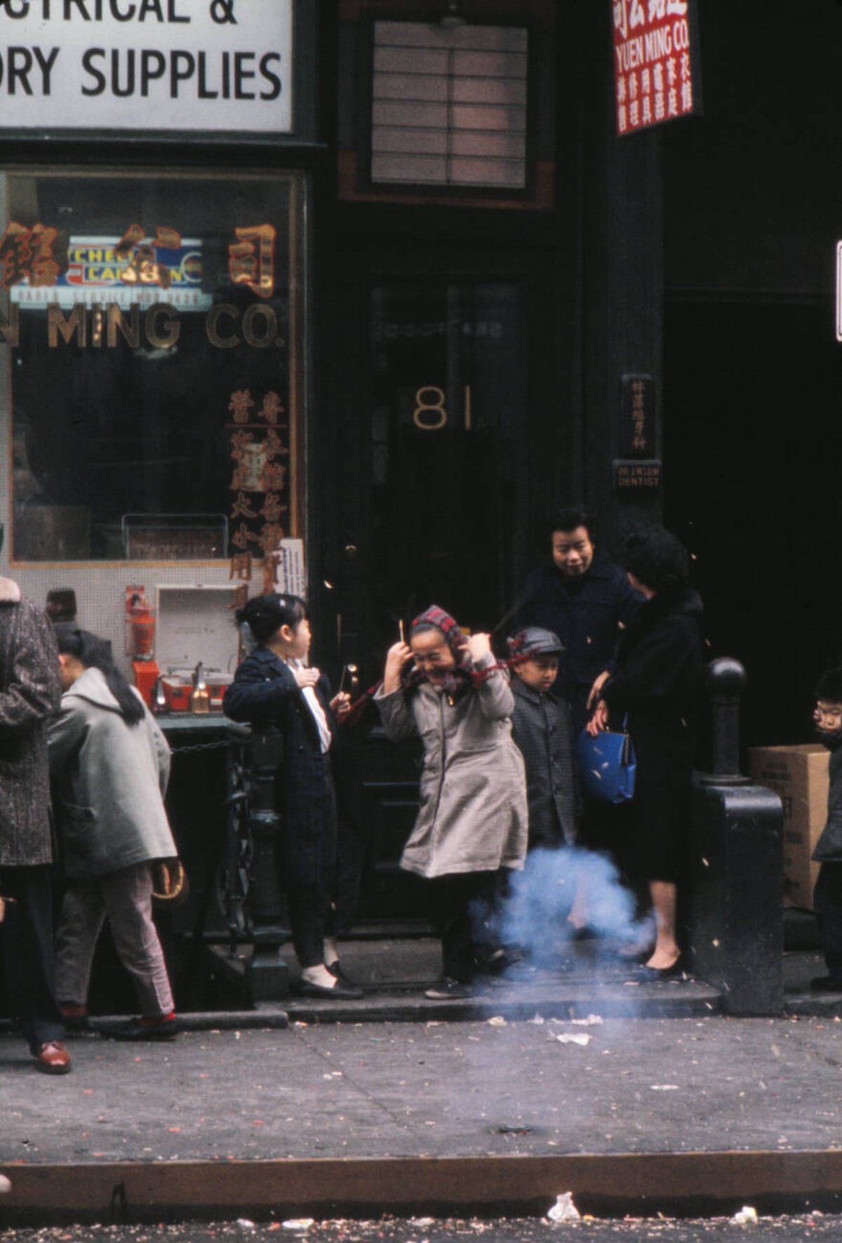 Children Lighting Firecrackers During The Chinese New Year Celebration In Chinatown, New York, 1963.
