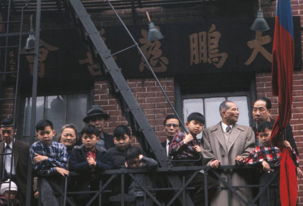 Residents Watching The Chinese New Year Parade From A Fire Escape In Chinatown, New York, 1963.