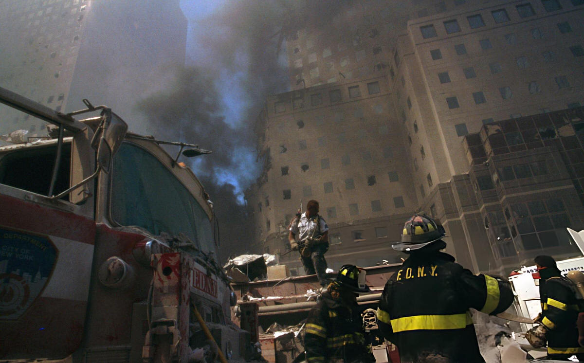 Firefighter Amidst The Rubble Of The World Trade Center Following The September 11 Attacks, 2001.