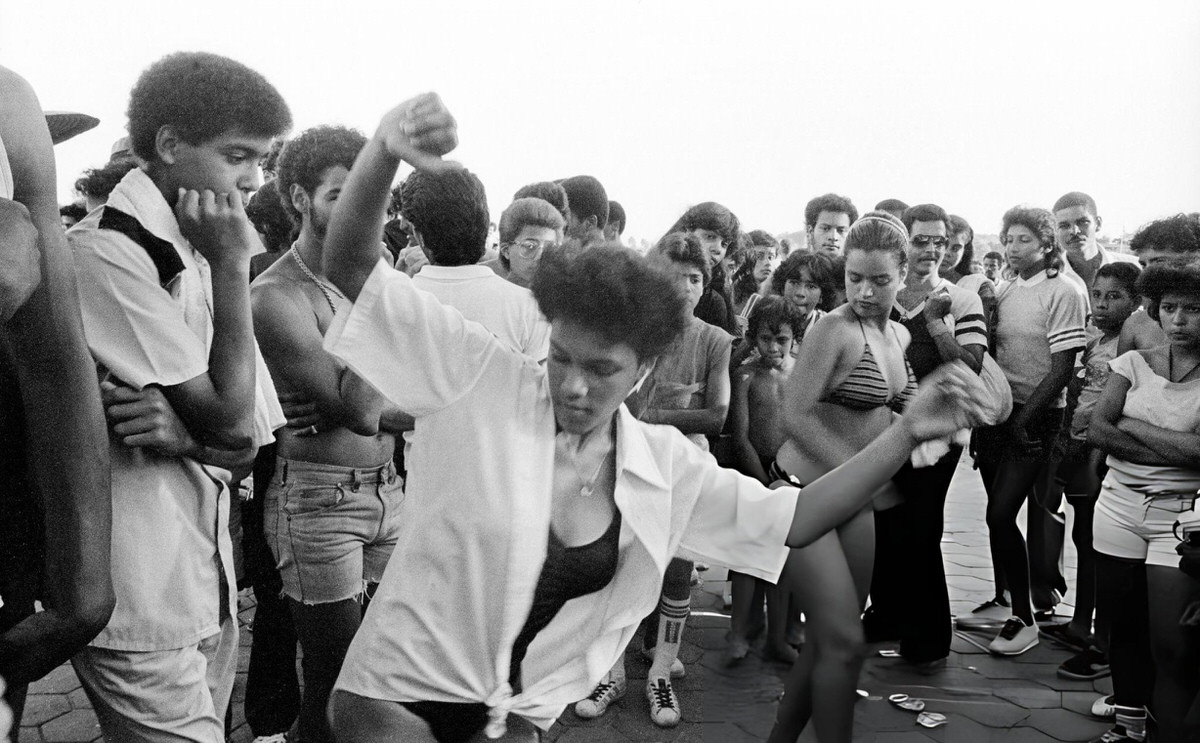 Two Women Dancing On The Boardwalk At Orchard Beach, Bronx, 1984.
