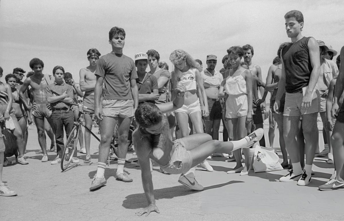 Man Breakdancing On The Boardwalk At Orchard Beach, Bronx, 1984.