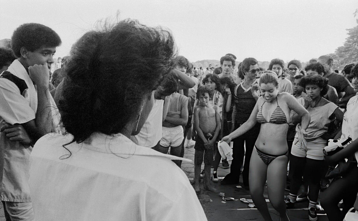 Two Women Dancing On The Boardwalk At Orchard Beach, Bronx, 1984.
