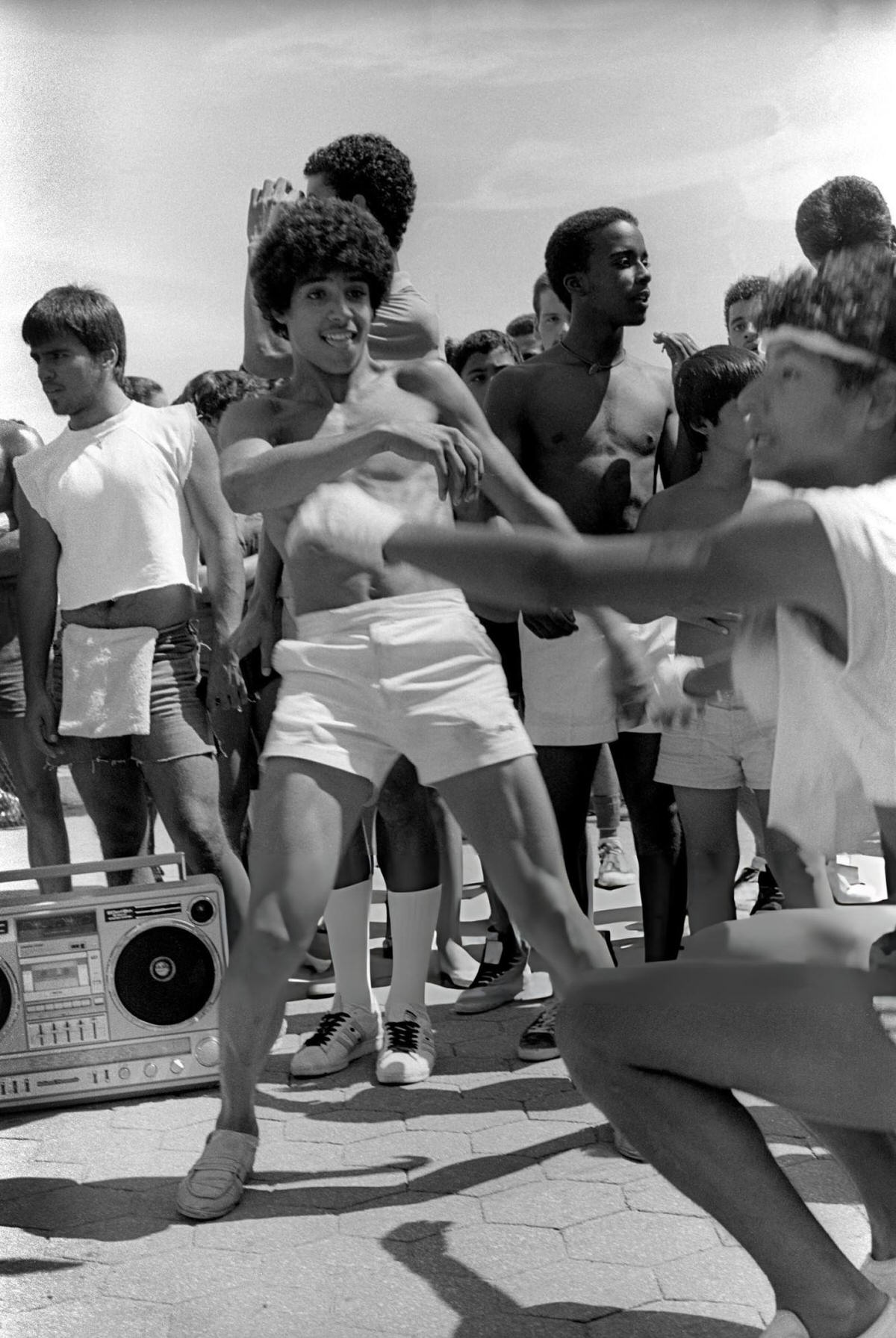 Two Young Men Dancing On The Boardwalk At Orchard Beach, Bronx, 1983.