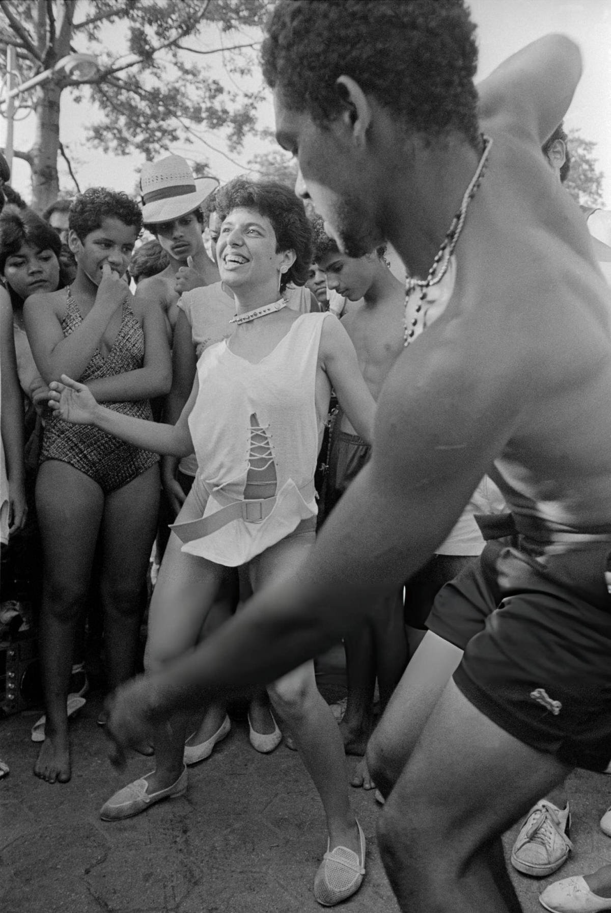 People Dancing On The Boardwalk At Orchard Beach, Bronx, 1984.