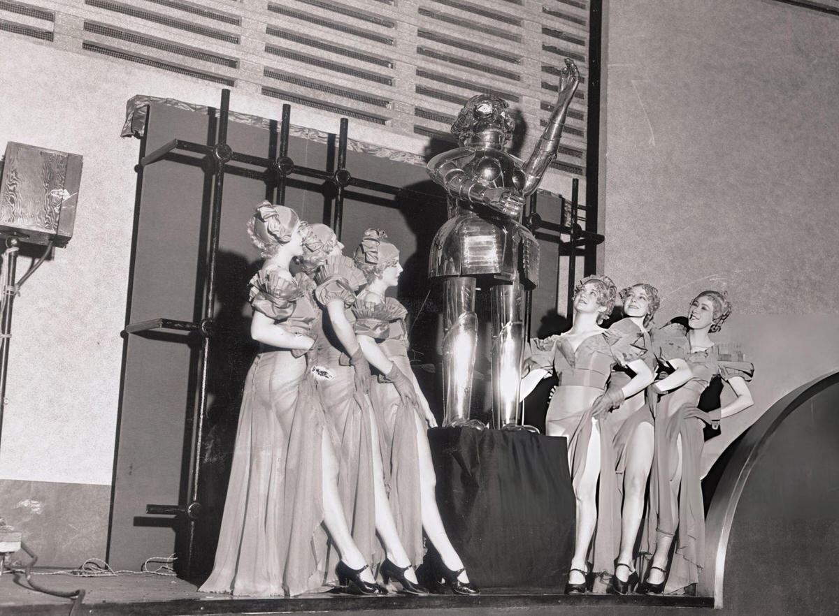 Alpha The Robot Acting As Master Of Ceremonies With Dancing Girls At Radio City Music Hall, New York.