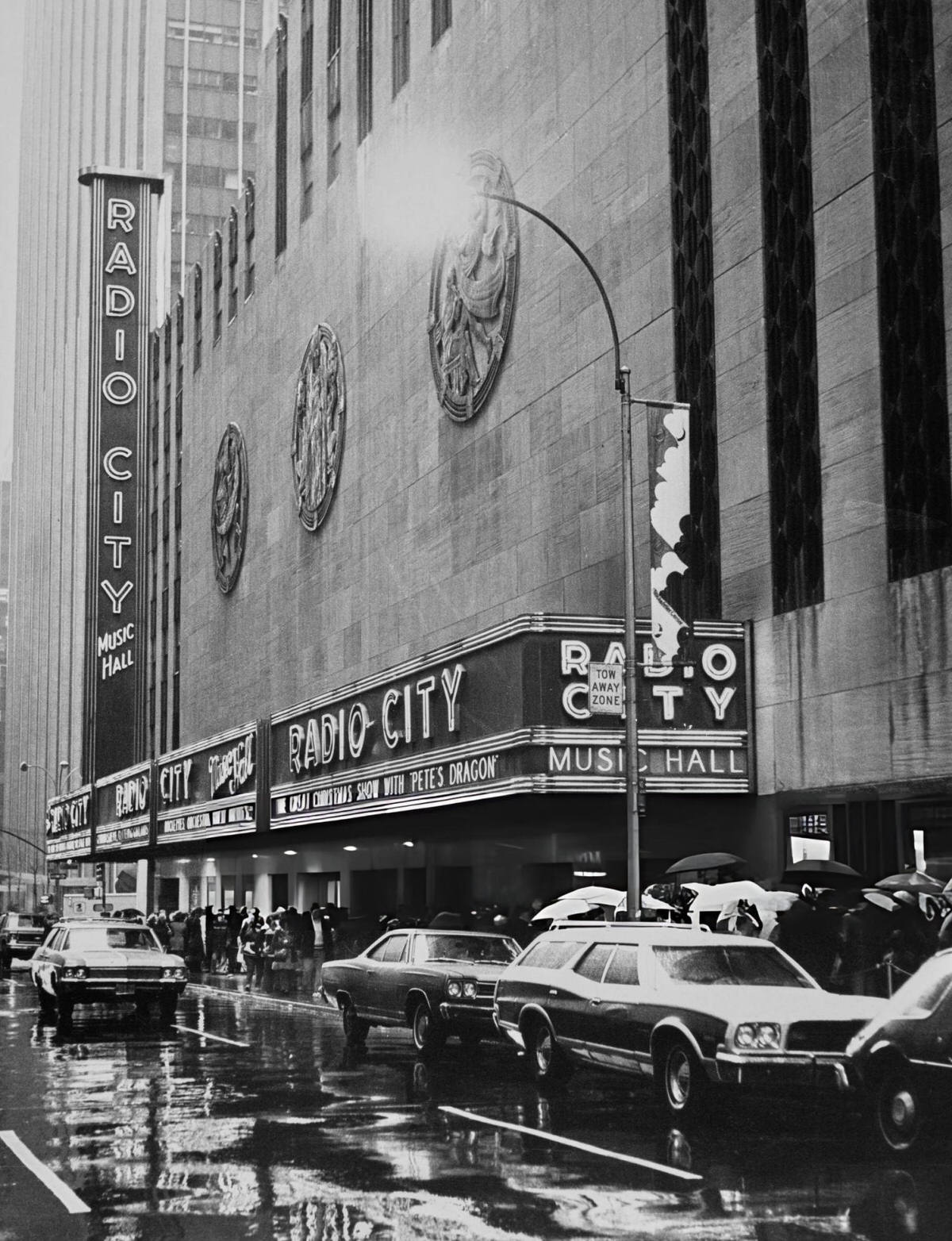 Traffic And Pedestrians Outside Radio City Music Hall On Avenue Of The Americas, New York, 1977.