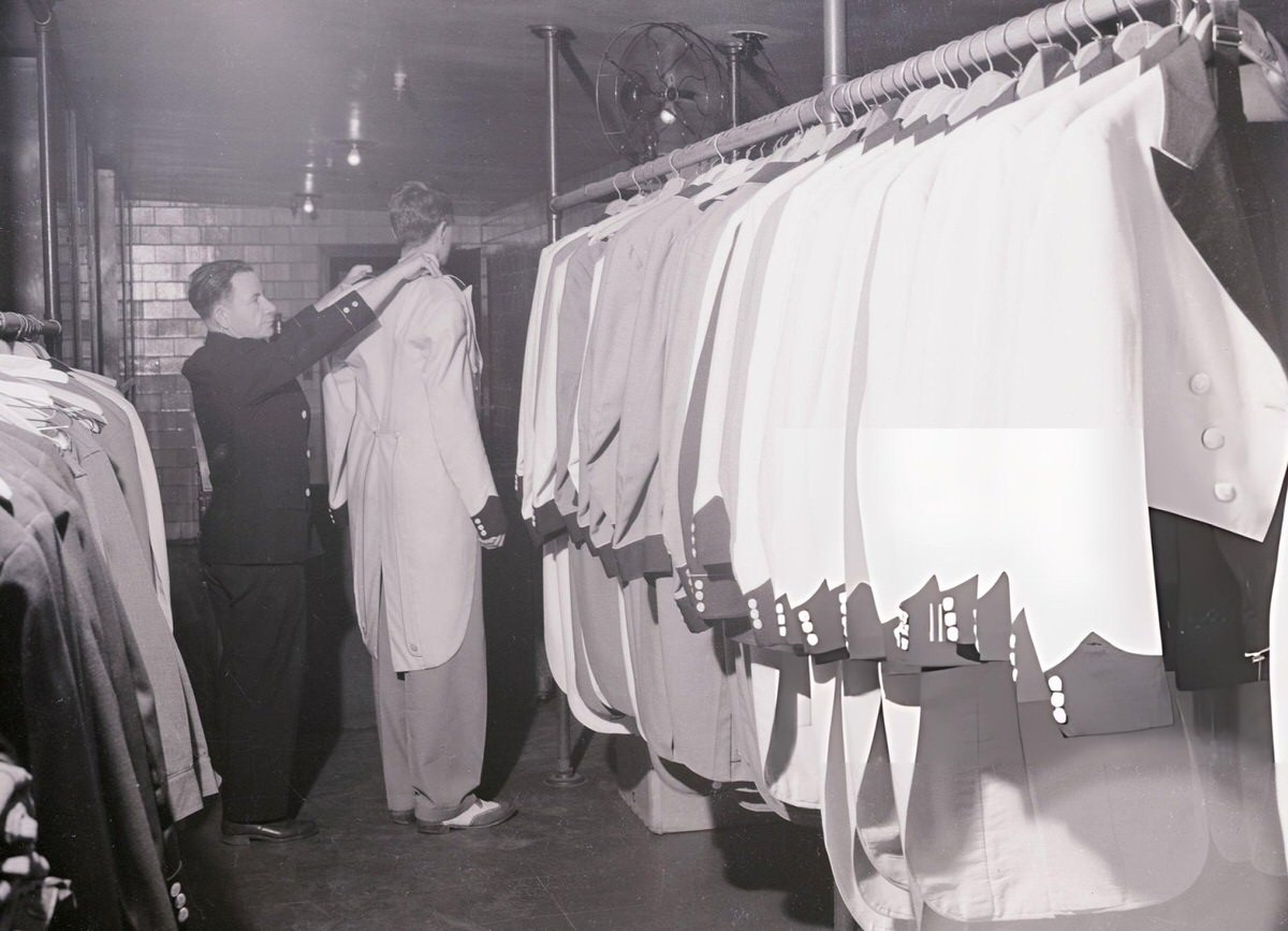 Doorman Being Fitted For A Uniform At Radio City Music Hall, New York.