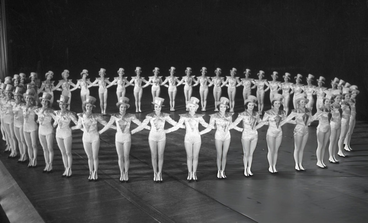 The Rockettes Forming A Circle On Stage At Radio City Music Hall, New York.