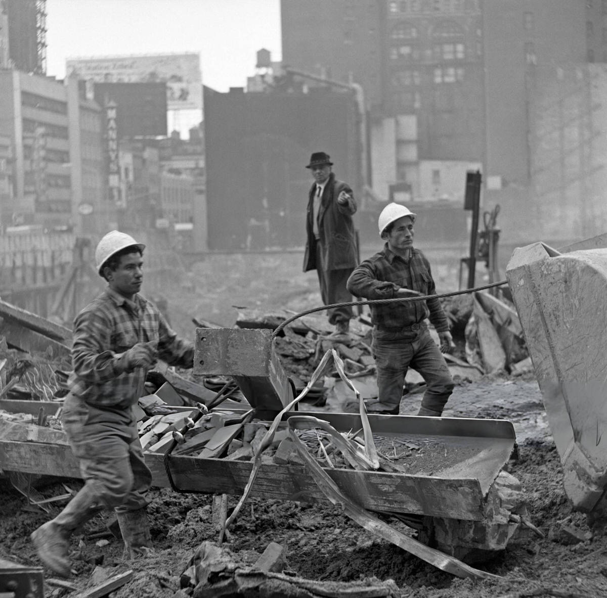 Construction Foreman Instructing Workers Moving Steel Beams During The Demolition Of The Singer Building, Downtown Manhattan, 1969.