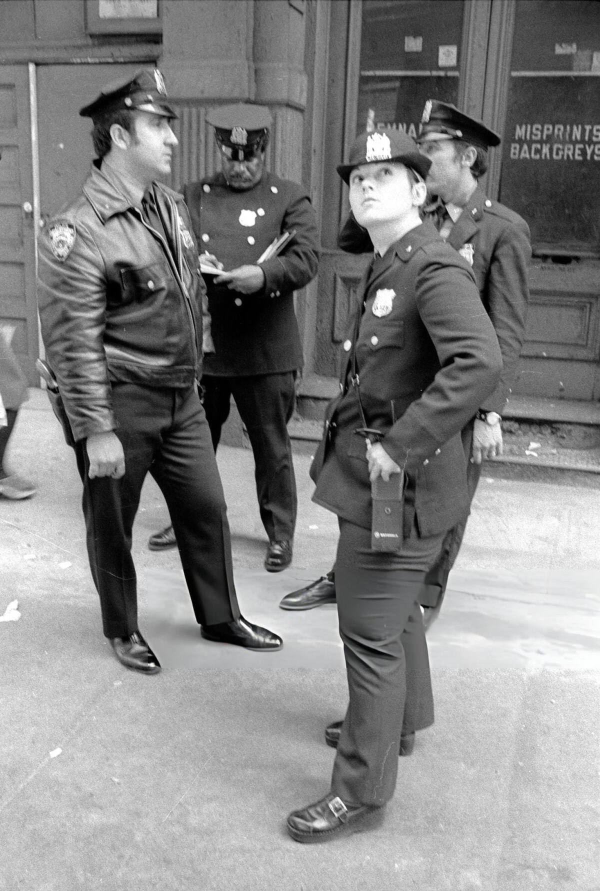 Nypd Officers Standing On A Sidewalk In Soho, 1974.