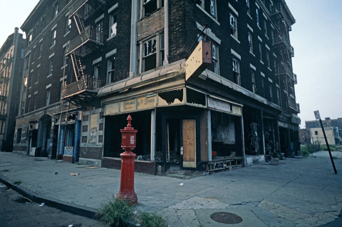 Abandoned Burnt-Out Tenement Blocks And Shops, South Bronx, 1977.