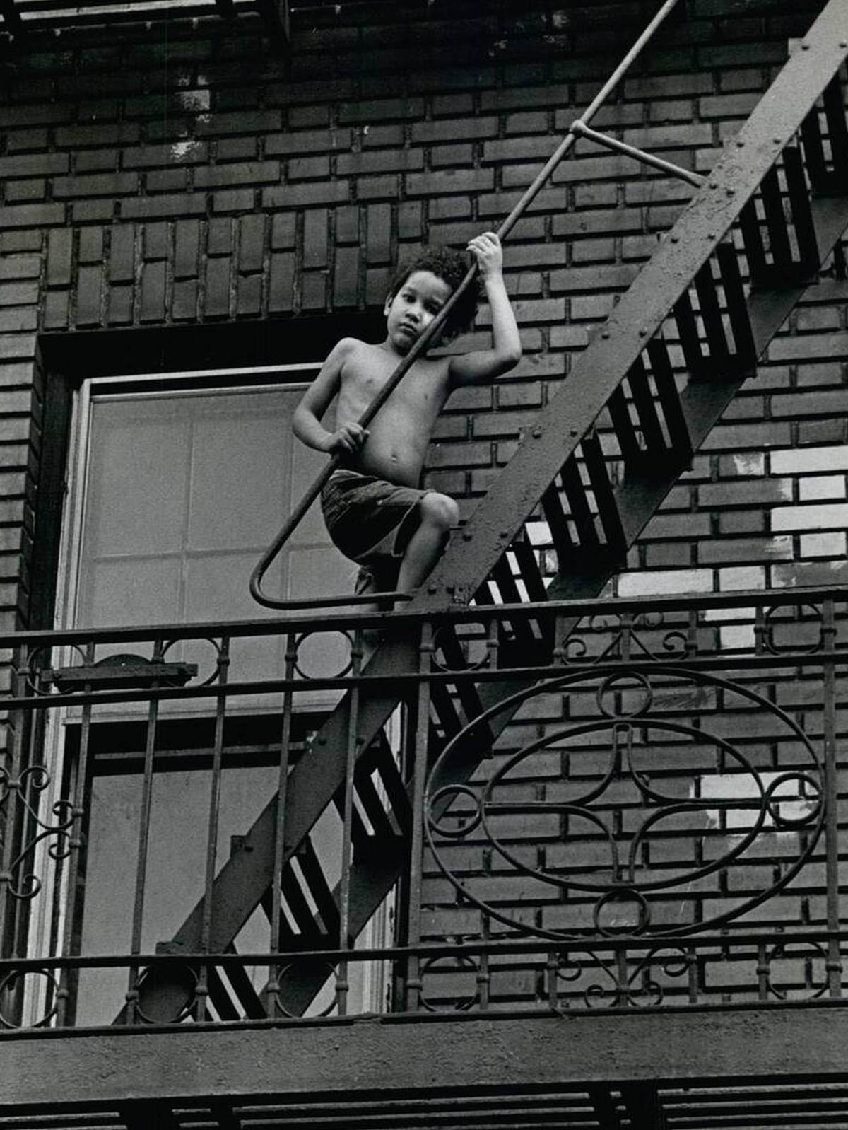 Child On Stairs In The South Bronx.