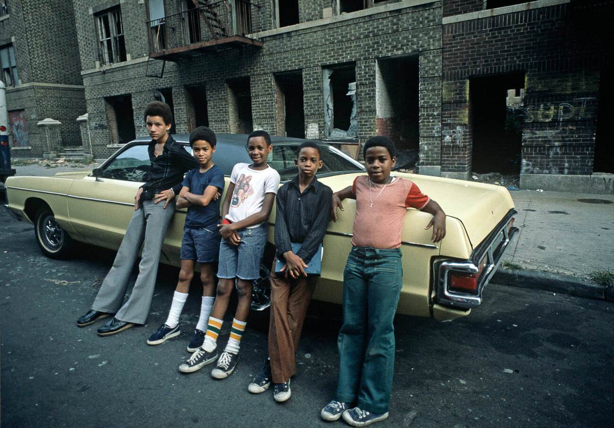 Teenagers In Front Of Abandoned And Burnt-Out Tenement Buildings, South Bronx, 1977.