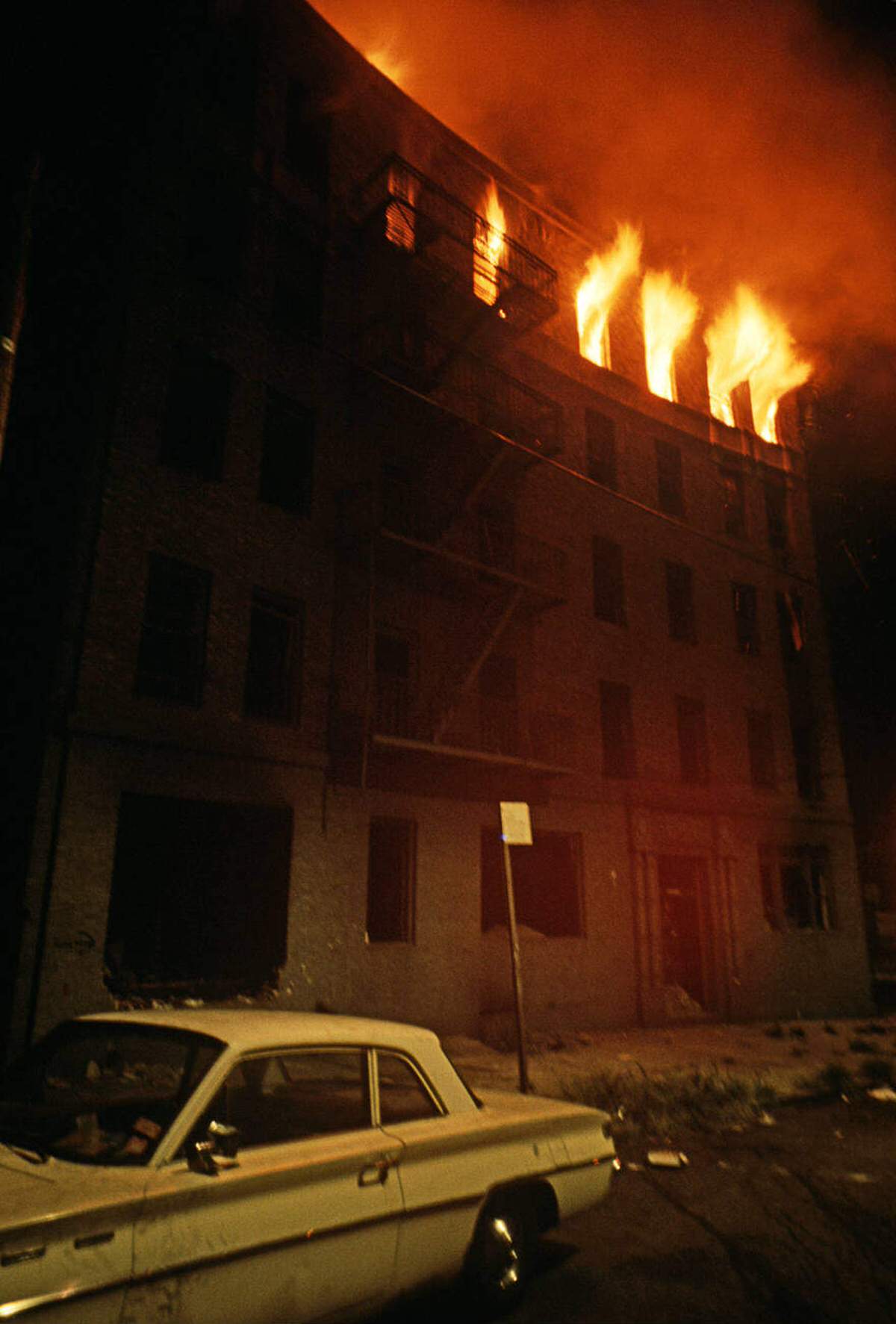 Abandoned Tenement Building On Fire, South Bronx, 1977.