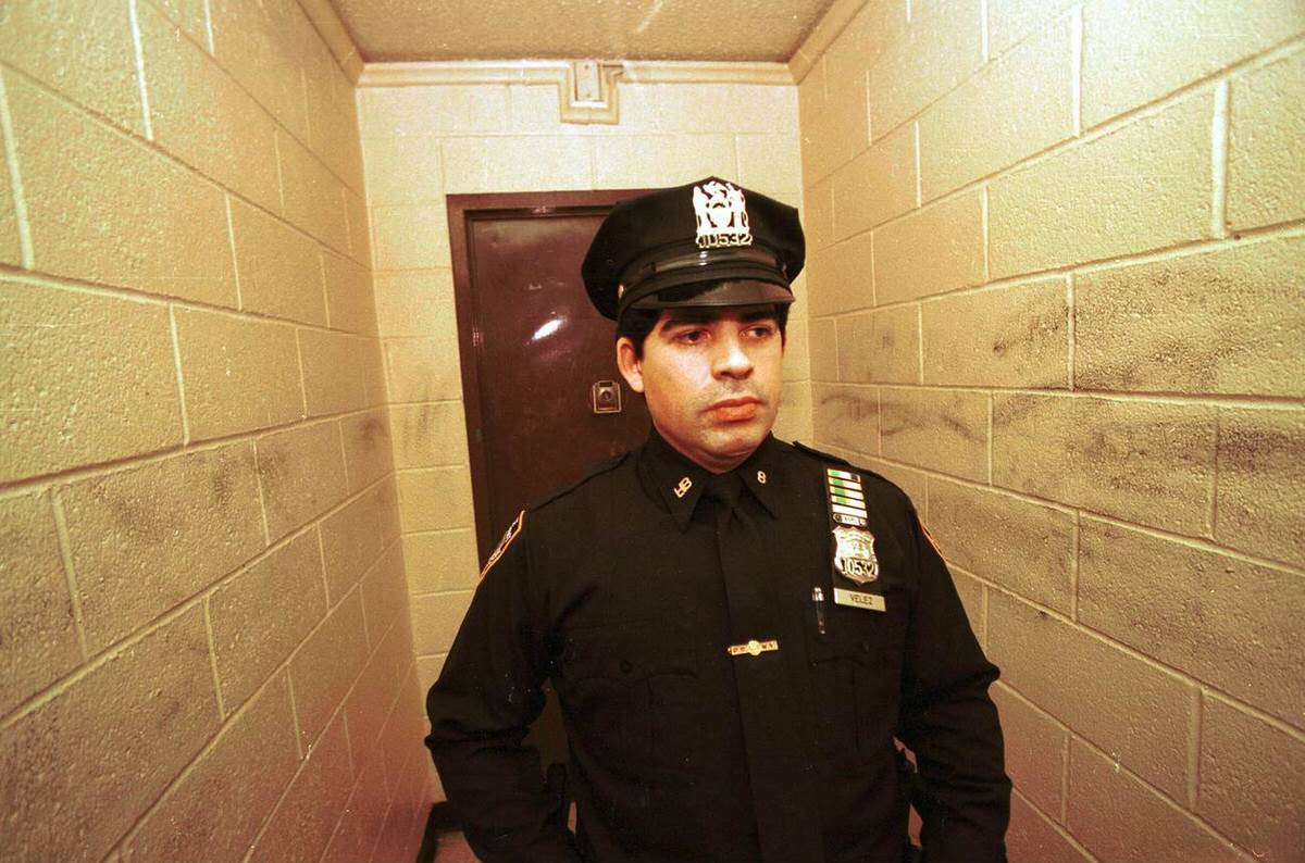 Police Officer Standing Guard In Front Of A South Bronx Apartment Building, 1998.