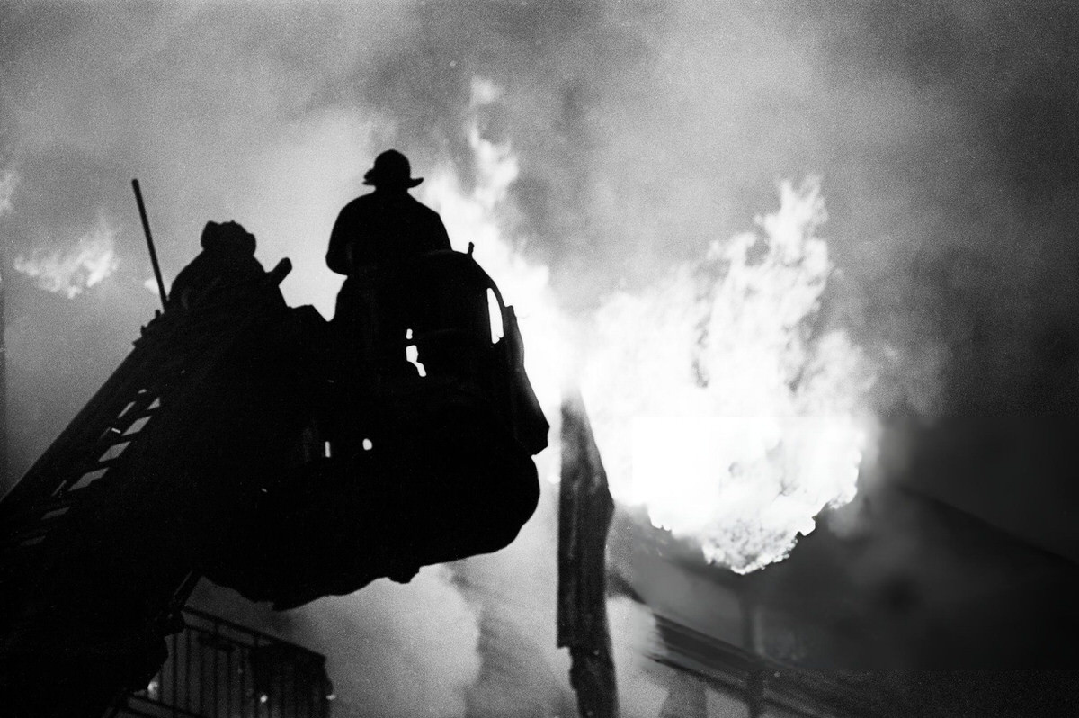 Firefighters On An Aerial Ladder Battling A Fire At 800 Fox Street, South Bronx, 1984.